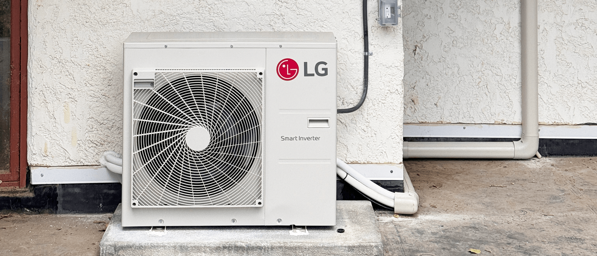 LG mini split condenser on concrete pad